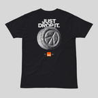 Black t-shirt with 'Just Drop It' text and pill graphic on a gray background