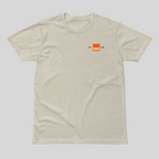 Beige t-shirt with a small orange logo on a light gray background